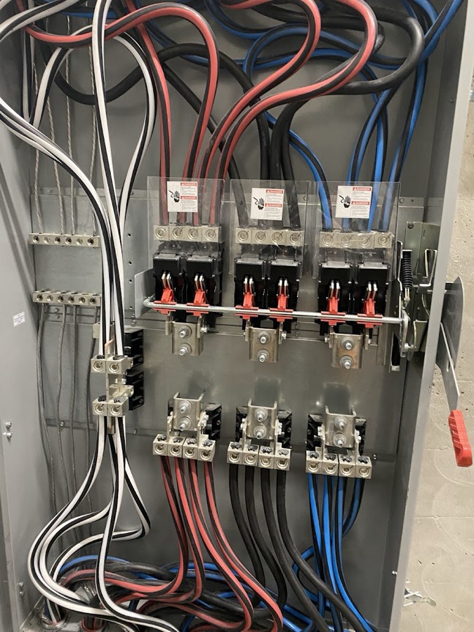 Electrical panel with breakers and neatly dressed wiring